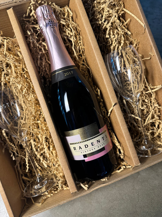 Bottle of Radenti sparkling wine with two glasses in a decorative box.
